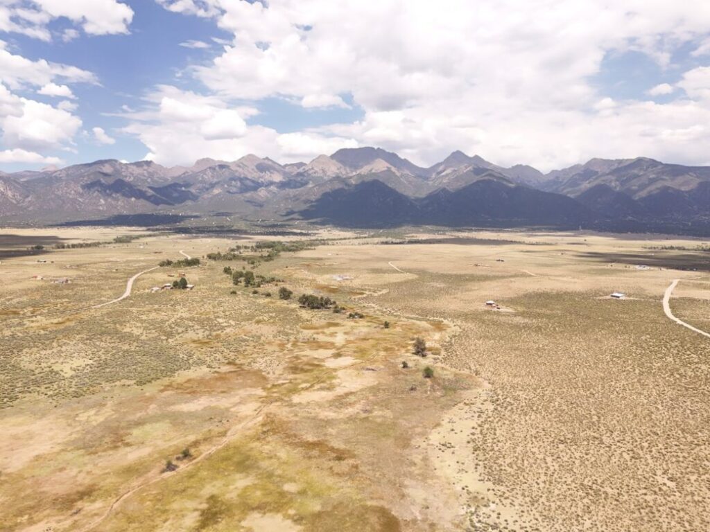 Drone view over open Costilla County land toward Blanca Peak in southern Colorado