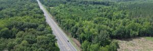 Aerial view of NC 14 highway with wooded property frontage, Reidsville NC — parcels 181763/181764/180667