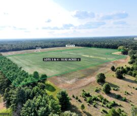 18.92-acre double lot for sale in Necedah, Juneau County, Wisconsin — aerial view with the parcel boundary and acreage marked