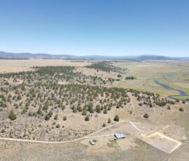 Aerial showing the juniper stands, the dirt road in, and the river valley east of the parcel - Chiloquin, OR (R349714)