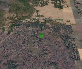 Google Earth 3D wider perspective showing the Fall River Mills area terrain and location of parcel 023-460-028-000, Shasta County, CA
