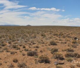 Wide desert landscape with cinder cone butte on the horizon, level terrain, Blanca CO APN 70302130