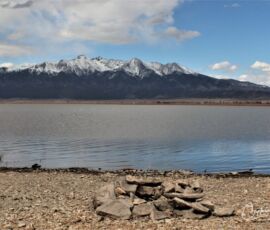 Shoreline fire pit at a nearby lake with Blanca Peak in view — area recreation near Blanca, CO
