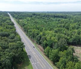 Aerial view of NC 14 highway with wooded property frontage, Reidsville NC — parcels 181763/181764/180667